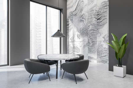 Corner view on dark dining room interior with dining table, armchairs, marble and gray wall,...