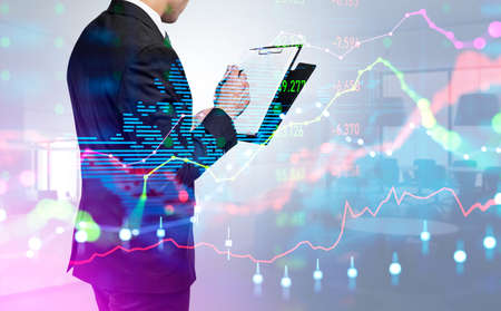 Businessman take note in business clipboard. Colorful forex diagrams with candlesticks and earth...
