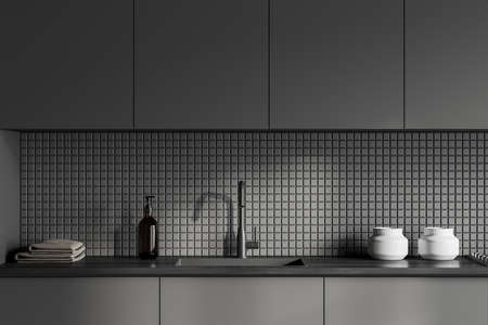 Dark kitchen interior with sink and appliances, hidden cabinets. Bowls and soap bottles, towels and shelves. Cooking space in modern apartment, 3D renderingの写真素材