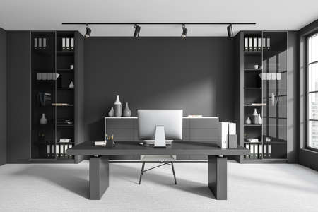 Dark ceo room interior with pc computer on work desk, carpet on the floor. Shelf with documents and decoration, panoramic window on city view. 3D renderingの写真素材