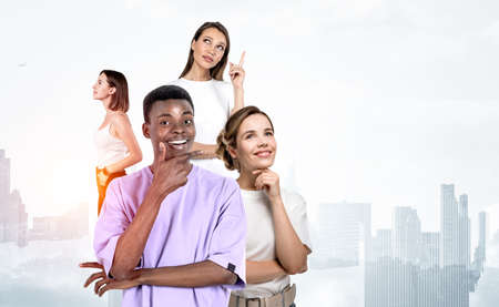 Multinational business student with smiling and thoughtful look, hand to chin and dreaming. Double...