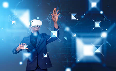 Black businessman working in vr headset, hands touching digital information fields and blocks on...