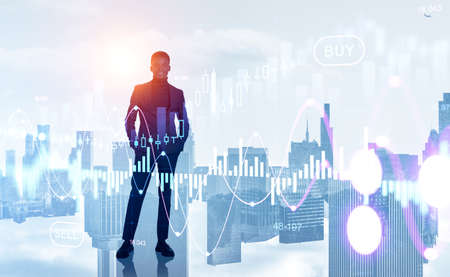Black businessman full length with hands in pocket, hud hologram with forex diagrams and New York skyline, double exposure. Concept of financial analysisの写真素材