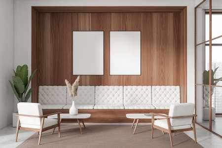Modern business room interior with sofa, two armchairs and coffee table, panoramic window with city...