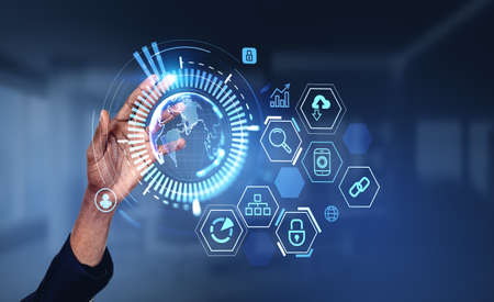 Black businessman hand, finger touch earth globe hologram with digital icons. Concept of global...