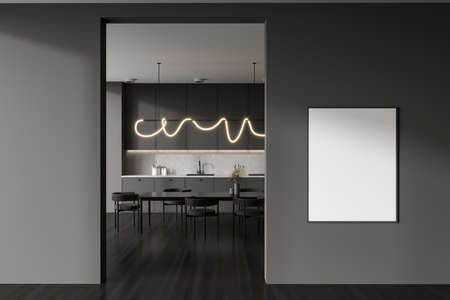 Dark kitchen interior with chairs and dining table on black hardwood floor. Minimalist kitchenware...