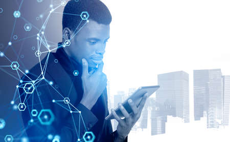 Black businessman using tablet, smiling and pensive silhouette portrait. Network hologram double...
