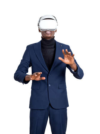 African businessman wearing vr glasses headset, fingers touching something, isolated over white...