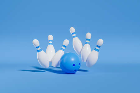 Blue ball striking white pins on blue background. Concept of success and score. copyspace. 3D renderingの写真素材