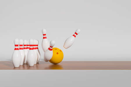 Yellow bowling ball striking pins on wooden lanes, side view. Concept of game and success. copyspace. 3D renderingの写真素材
