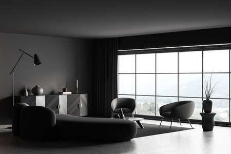 Corner view on dark living room interior with panoramic window, coffee table, sofa, armchairs, carpet, gray wall, books, lamps, crockery, concrete floor. Concept of minimalist design. 3d renderingの写真素材