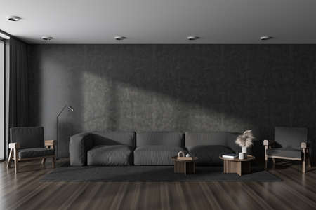 Dark meeting room interior with sofa and armchairs, coffee table with art decoration, carpet on...