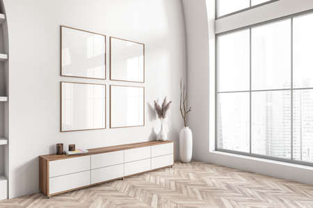 White living room interior with sideboard, side view, vase with branch in the corner on hardwood floor. Panoramic window on city skyscrapers. Four square mock up posters. 3D renderingの写真素材