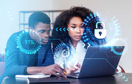Black business people working with laptop, double exposure with digital statistics hologram,...
