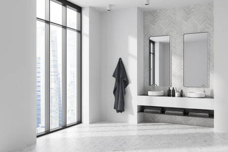 Corner view on bright bathroom interior with two mirrors, panoramic window with city skyscraper view, sinks, white walls, concrete floor, shelves with towels, liquid soap. 3d renderingの写真素材