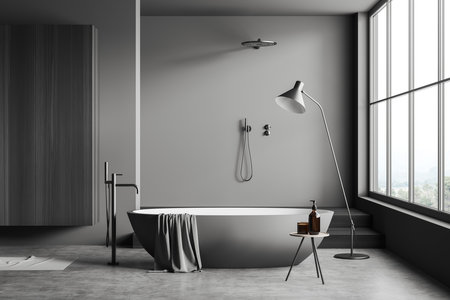 Front view on dark bathroom interior with bathtub, panoramic window with countryside view, shower, gray walls, concrete floor, wardrobe, liquid soap. 3d renderingの写真素材