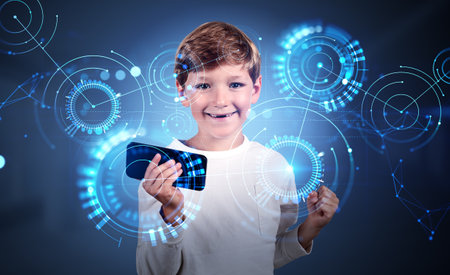 Happy child portrait, boy with a raised fist and smartphone. Virtual screen with neural networks and...