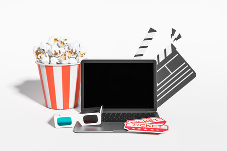 Laptop with black mockup screen, pop corn and two tickets, clapper and 3D glasses on white background. Concept of online cinema. 3D renderingの写真素材