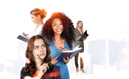 Multinational businesswomen studying together, taking note and pen to chin, thinking and taking...