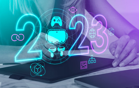 Woman designer with stylus in hand drawing on graphic tablet. Neon 2023 year numbers hud, vr glasses...