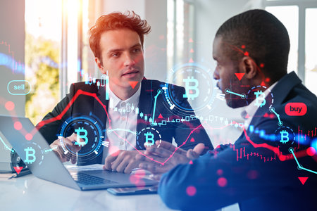 Businessmen talking and working with laptop, cryptocurrency hologram with red lines. Bitcoin crisis and internet banking collapse hologram. Concept of teamwork and researchの写真素材