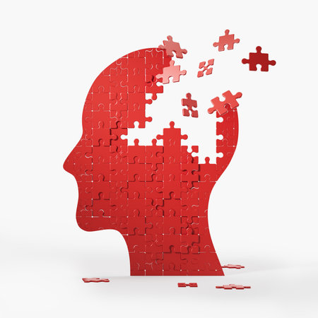 Red human head profile with jigsaw puzzle pieces falling, flying away on white background. Concept...