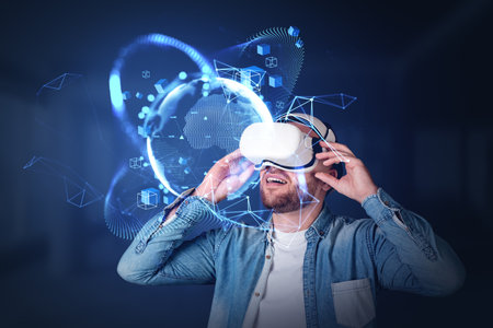 Businessman wearing casual wear and vr googles watching at metaverse reality with virtual globe and blockchain system. Concept of futuristic technology, virtual reality, progressive people in businessの写真素材