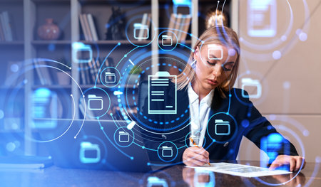 Businesswoman sign a contract, document management system hologram with folders. Concept of online database and business files storageの写真素材