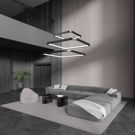 Corner of luxury living room with beige and gray walls, dark marble floor, comfortable gray couch,...
