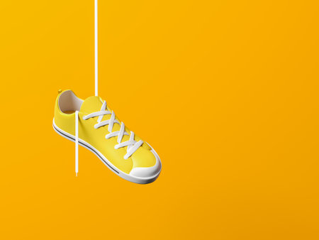 One yellow sneaker hanging on a white lace, empty copy space background. Concept of training, fitness and sports shoes. 3d renderingの写真素材
