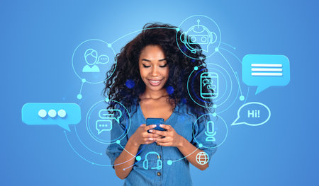 Smiling african woman working with Chatbot online in mobile phone. Chat bot hologram icons, using AI...