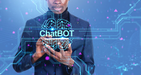 Unrecognizable African American businessman using tablet over blue background with double exposure of immersive chatbot interface. Concept of artificial intelligence and machine learningの写真素材