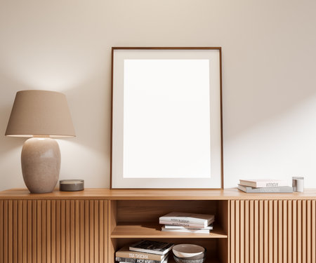 Beige living room interior with wooden sideboard and stylish art decoration with books, minimalist scandinavian design. Mock up canvas poster. 3D renderingの写真素材