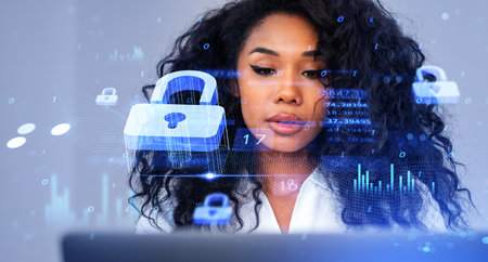 Portrait of young African American businesswoman using laptop in blurry office with double exposure...