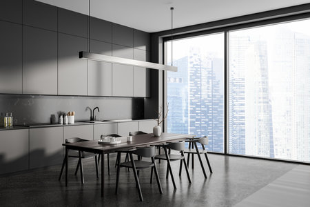 Dark minimalist home kitchen interior with dinner table and chairs, side view. Cooking corner with concealed shelves and kitchenware. Panoramic windows on skyscrapers. 3D renderingの写真素材