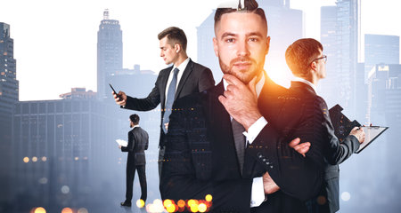 Portrait of business team members working with gadgets and documents with double exposure of New York city. concept of teamworkの写真素材