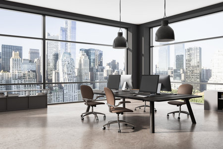 Dark coworking interior with armchairs, pc computer in row on a shared table, side view. Business room corner with sideboard and panoramic window on skyscrapers. 3D renderingの写真素材