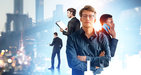 Portrait of four diverse businessmen using gadgets and working with documents with double exposure of cityscape. Concept of teamwork and communication. New York city Manhattan island. Brooklynの写真素材