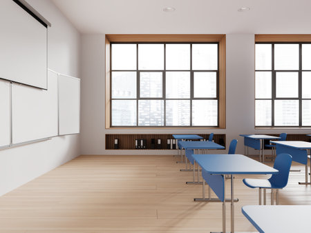 Interior of modern classroom with white walls, wooden floor, rows of blue tables and chairs and mock up projection screen and whiteboard. 3d renderingの写真素材