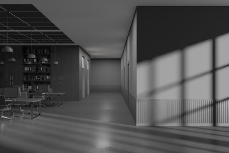 Interior of stylish open space office with gray and dark wooden walls, concrete floor, comfortable computer tables with gray chairs, bookcase and blank copy space wall on the right. 3d renderingの写真素材