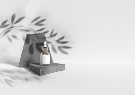 Small serum bottle on concrete, stone platform with leaves shadow on empty white background. Concept of skincare and cosmetics. Mockup for product presentation. 3D rendering illustrationの写真素材