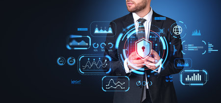 Businessman typing in phone, big business data protection, graph with lines and numbers, indicators and padlock icon with shield. Concept of cyber security and privacyの写真素材