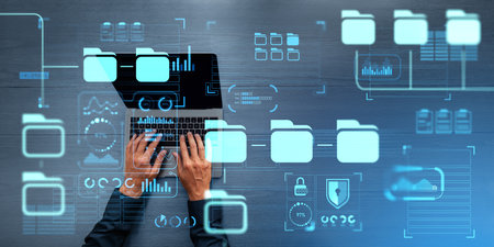 Top view of man hands typing on laptop, virtual screen with document management system, cloud...