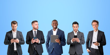 Five multinational businessmen working together, portraits in row on copy space blue background...