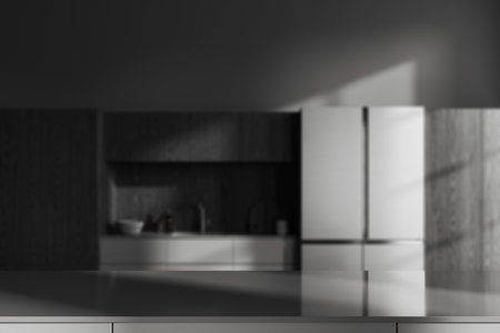 Gray product display table standing in blurry loft kitchen with gray walls, dark wooden cupboards, big fridge and gray cabinets with built in sink. 3d rendering, copy spaceの写真素材