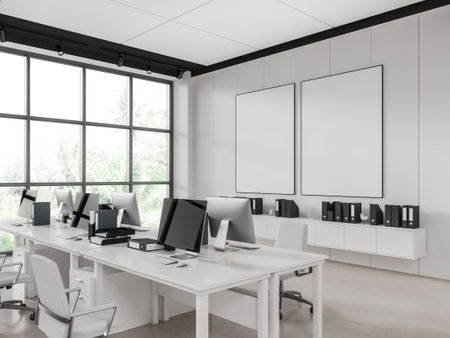 White coworking interior with office chairs, sideboard and desk with pc computer monitors in row, side view. Panoramic window on the tropics. Two mock up canvas posters. 3D renderingの写真素材