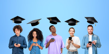 Five young people with smartphone in hand, portraits in row with flying graduation hat. Using...