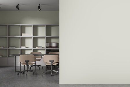 Interior of modern meeting room with light green walls, concrete floor, long gray conference table with beige chairs, bookcase with folders and white copy space wall on the right. 3d renderingの写真素材