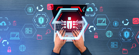 Top view of businessman hands typing on laptop with double exposure of futuristic cybersecurity bug...