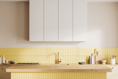 Elegant home kitchen interior with wooden bar counter, cabinet with kitchenware and sink with stove. Yellow and white cooking and dining area in contemporary apartment. 3D renderingの写真素材